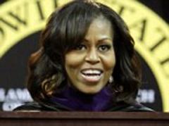 I can finally see! Michelle Obama debuts a new longer hairdo with 'irritating bangs' swept to the side