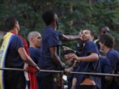 gerard pique and alex song fight on top of barcelona bus parade