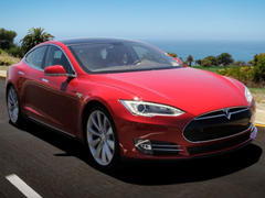 tesla motors rides all-time high, offers more stock, new debt